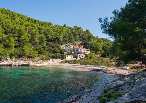 Beautiful and private beach villa with heated infinity pool close to Hvar town