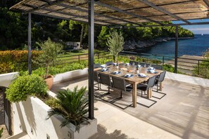 Outdoor dining - Beautiful and private beach villa with heated infinity pool close to Hvar town (Brusje)