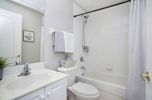 Combined shower/tub, hair dryer, towels, soap