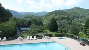 A swimming pool with lounge chairs and a view of a mountainous landscape. - Relaxed Retreat with Premiere Location and Views, Only 6 Steps to Get In, Garage (Whittier)