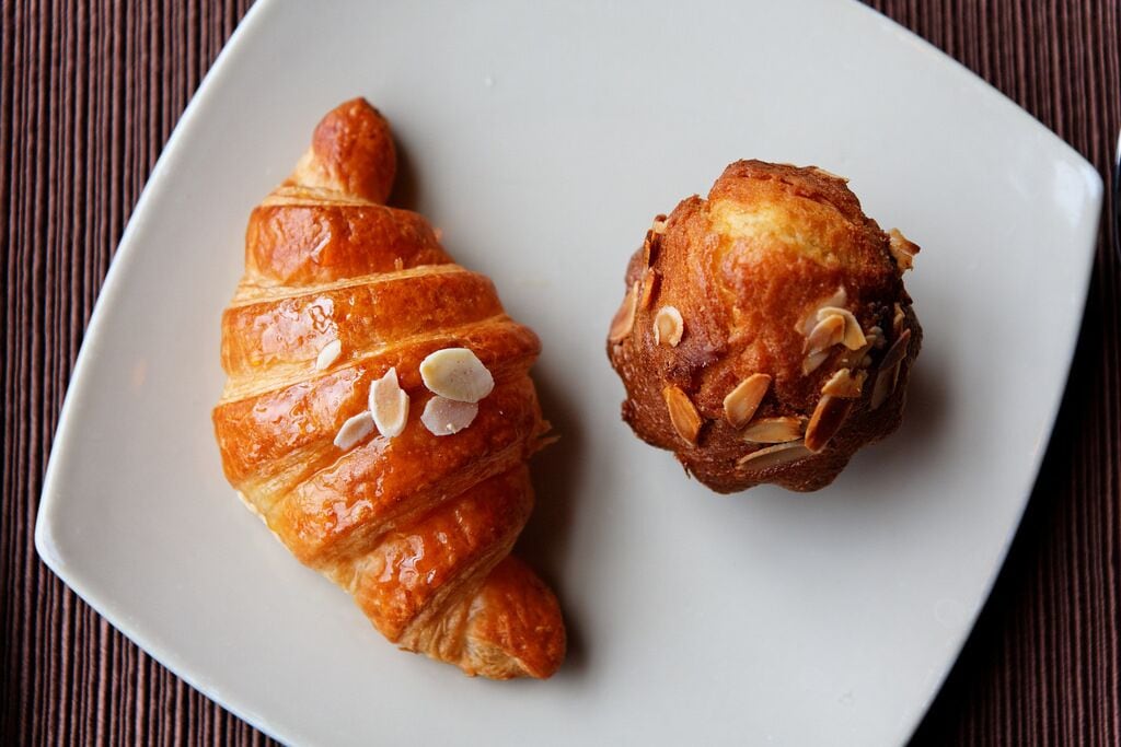 Two pastries on a white plate.