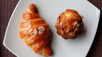 Two pastries on a white plate.