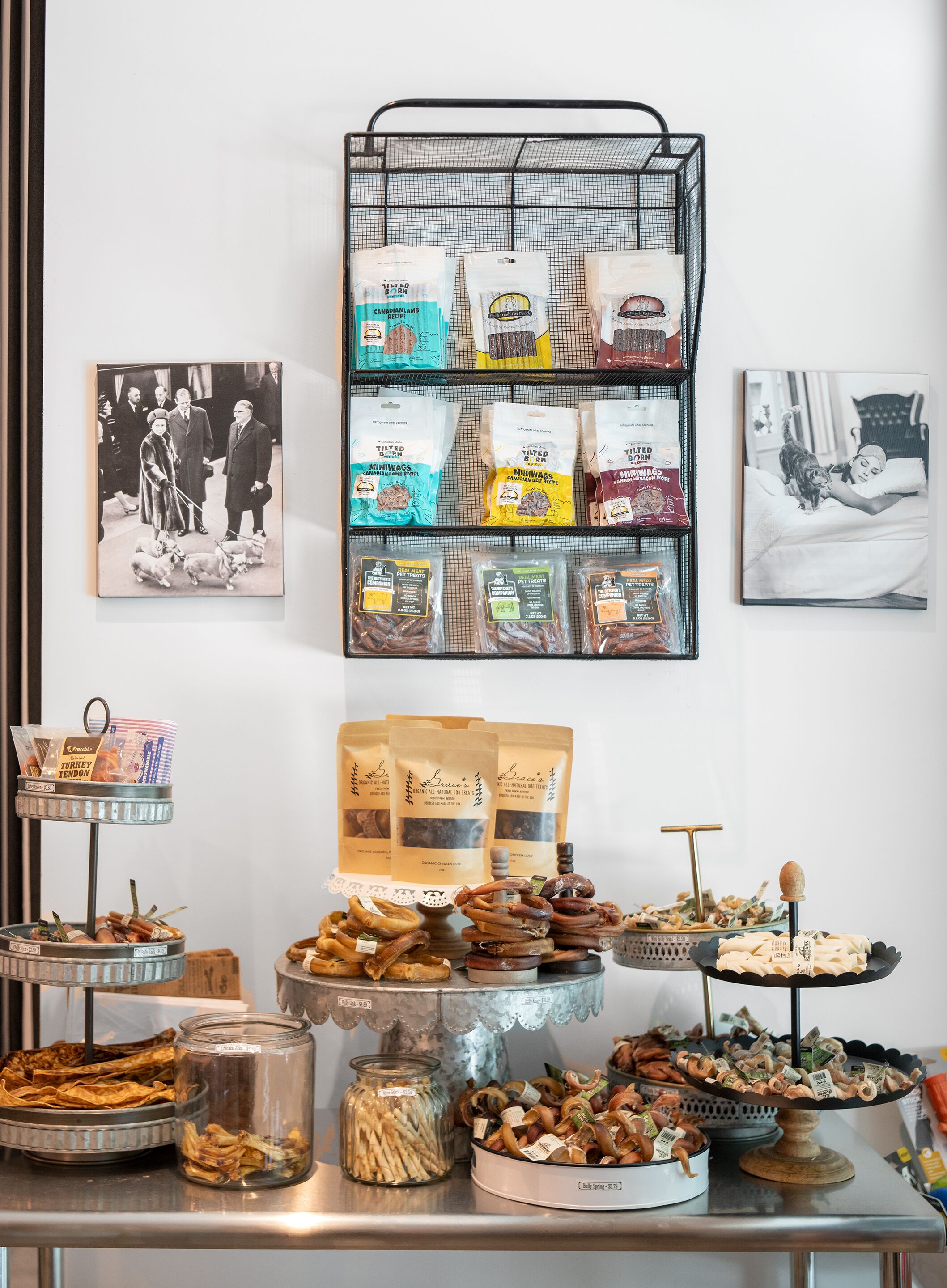 A buffet table with various food items and a display of pet food bags.