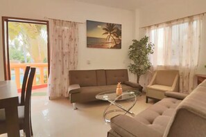 Family Apartment, 1 Bedroom, Garden View (#4) | Living area - Suites Ximajo (Puerto Escondido)