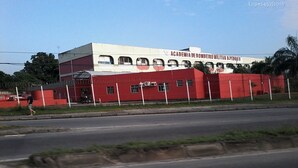 A building with a white and red facade, featuring a sign that reads "Academia de Bombeiro Militar". - Casa 1 (Rio de Janeiro)