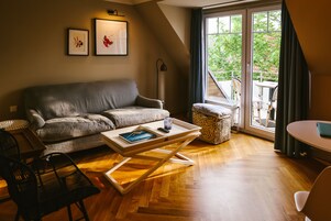 Comfort Apartment, 1 Bedroom, Balcony | Living area | Flat-screen TV, heated floors