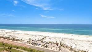 A beach with a parking lot and a road leading to the beach. - 2B Gulf Front*Tower 5*Stunning Views (Pensacola Beach)
