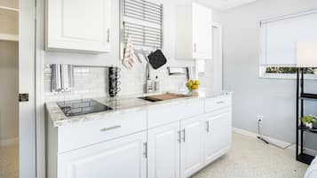 Fridge, microwave, stovetop, coffee/tea maker