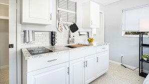 Fridge, microwave, stovetop, coffee/tea maker