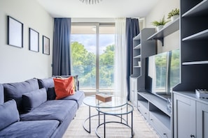 Deluxe Apartment | Living area | 43-inch Smart TV with digital channels, TV