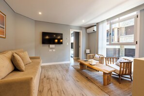 Standard Apartment | Living area | 50-inch TV with satellite channels, heated floors