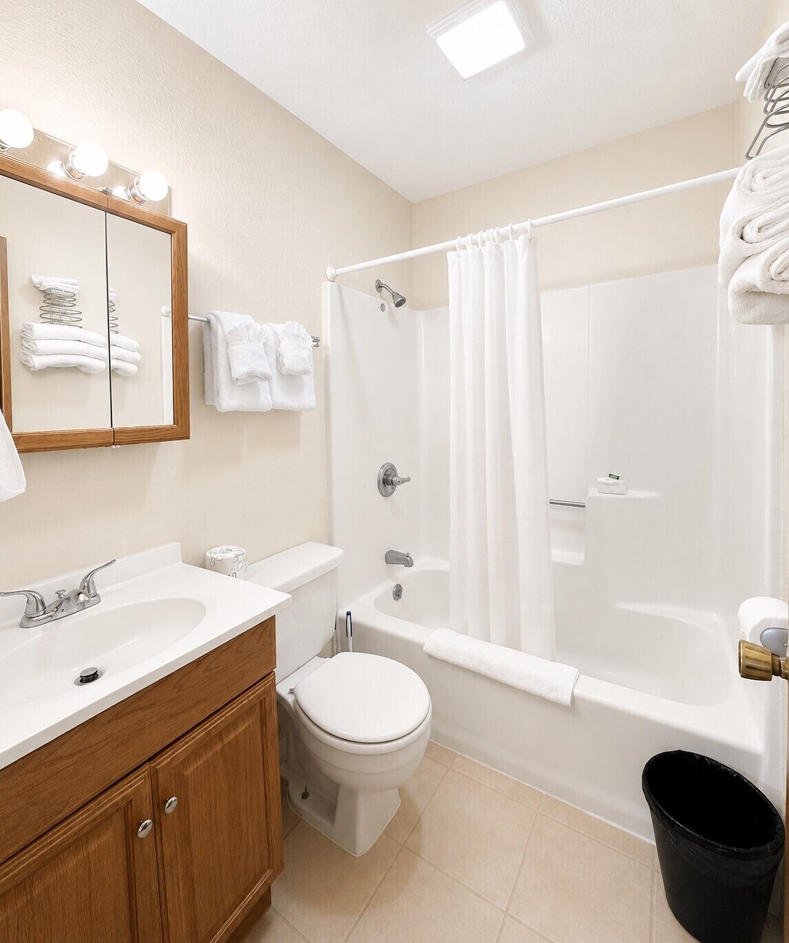A bathroom with a sink, toilet, and bathtub.