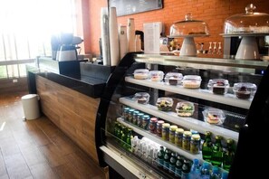 A buffet area with various food items and beverages.