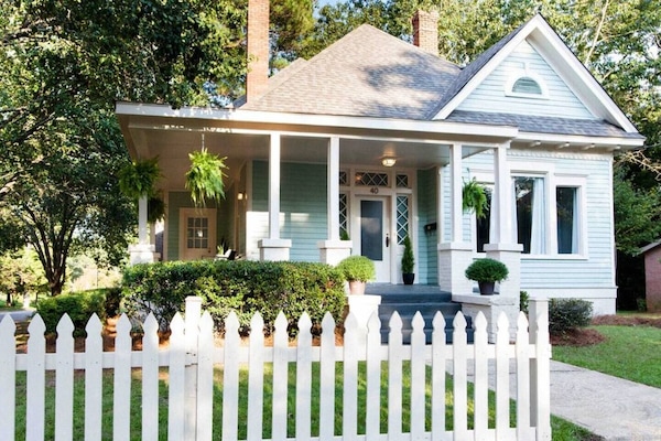Your Southern stay awaits. White picket fence included