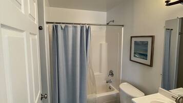 Combined shower/bathtub, hair dryer, towels, soap