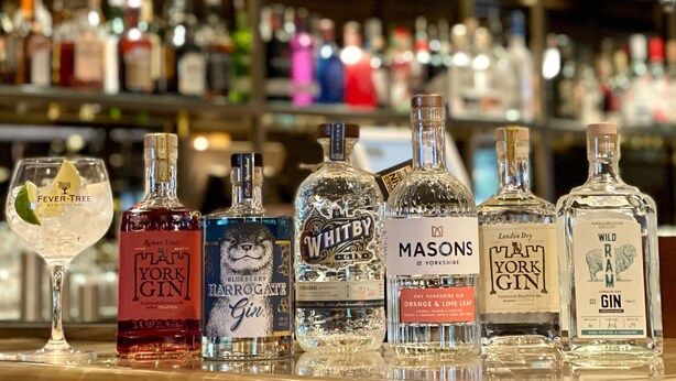 A bar with various bottles of gin and other spirits. - The Inn South Stainley (Harrogate)