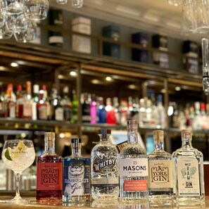A bar with various bottles of gin and other spirits. - The Inn South Stainley (Harrogate)