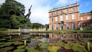 A historic building with a large pond and lily pads in front. - The Inn South Stainley (Harrogate)