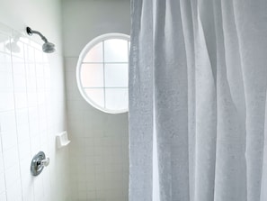 Combined shower/tub, hair dryer, towels, soap