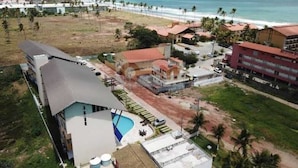 A resort with a pool, beach access, and a view of the ocean. - Villas Do Atlântico (Ipojuca)