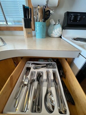 Fridge, coffee/tea maker, cookware/dishes/utensils, spices