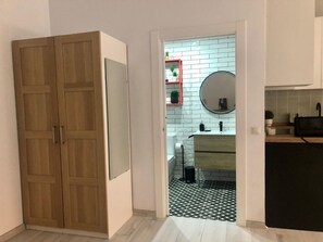 Shower, hair dryer, towels, toilet paper