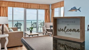 A room with a view of the ocean, a welcome sign, and a pool table. - Luxury Oceanfront 3 Bedroom Condo On The Boardwalk! (Myrtle Beach)