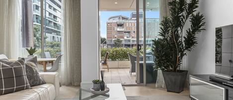 Deluxe Apartment | Living area | 50-inch Smart TV with satellite channels, TV