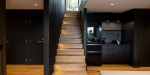 Luxury Villa | Living area | 65-inch Smart TV with digital channels, TV, fireplace - Kaitiaki Lodge - Pool & hot tub (Waiheke Island)