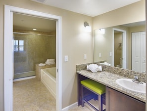 Bathtub, hair dryer, towels, soap