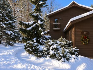 A snow-covered landscape with a wooden cabin labeled '57' and a wreath on the door. - Lake View Berkshire Retreat – Private Setting Near Lenox (Lee)