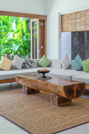 Deluxe Villa | Living area | 40-inch Smart TV with satellite channels, books - Villa Puri Aman - 3BR Private Pool Villa in Canggu with Garden Oasis, Near Beach (Canggu)
