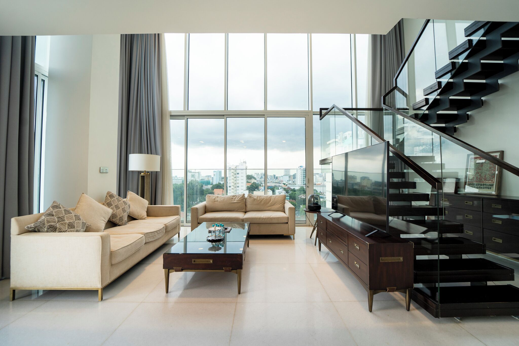 Family Apartment | Living area | 65-inch Smart TV with cable channels, TV, smart speakers