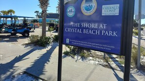 A sign for Crystal Beach Park with logos and text indicating it's a destination in Florida. - West Destin!  3 blks to beach! Front & back porch! Walk to shopping/restaurants (Destin)