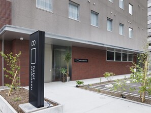 Welcome to our hotel, where a beautiful garden and inviting entrance set the tone for a relaxing stay.