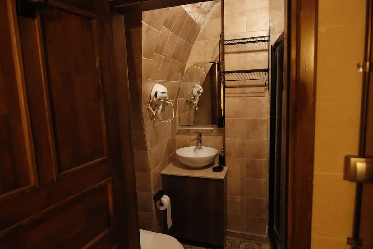 deluxe quadruple room | bathroom | shower, rainfall showerhead, designer toiletries, hair dryer