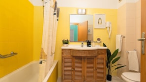 Bathtub, hair dryer, towels