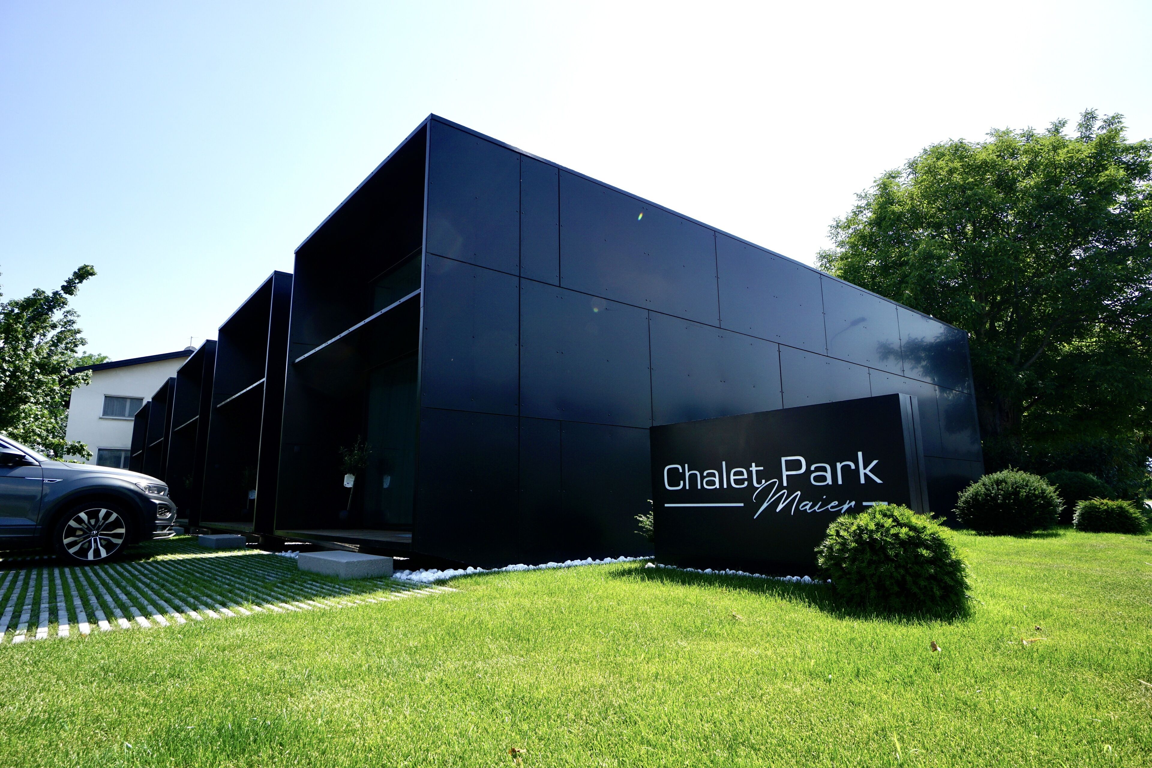 A modern building with a sign reading "Chalet Park."
