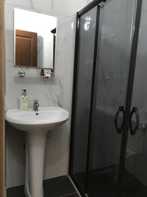 Shower, hair dryer, towels, soap