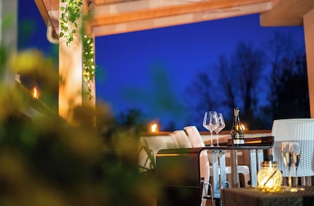 Outdoor dining. Surrounded by greenery, offers its guests a unique atmosphere.