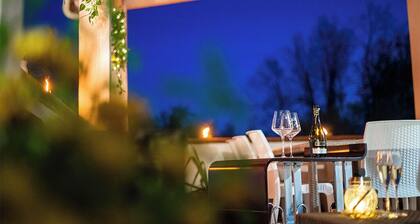 Surrounded by greenery, offers its guests a unique atmosphere.