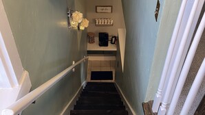 A staircase with dark wooden steps, white handrails, and a light blue wall. - Beautiful Benton Beauty (Saint Charles)
