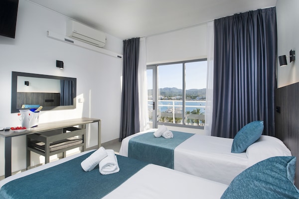 Twin Room, Sea View | Desk, laptop workspace, WiFi (free), bed sheets