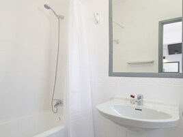 Combined shower/tub, hair dryer, soap, shampoo