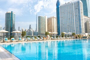 Outdoor pool, open 7:00 AM to 9:00 PM, pool loungers