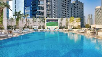 Outdoor pool, open 7:00 AM to 9:00 PM, pool loungers