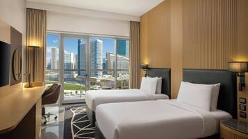 Deluxe Room, 2 Single Beds, Balcony, City View | Down duvets, in-room safe, desk, blackout curtains