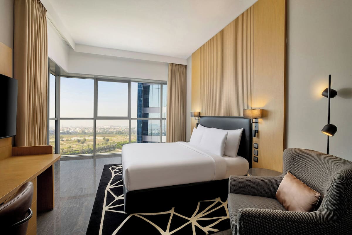 Deluxe Room, 1 King Bed, City View | Down duvets, in-room safe, desk, blackout curtains