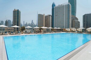 Outdoor pool, open 7:00 AM to 9:00 PM, pool loungers
