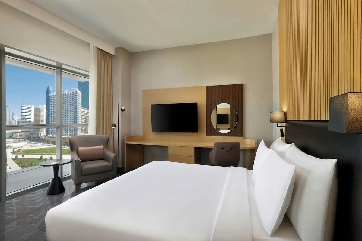 Premier Room, 1 King Bed, Pool View | Down duvets, in-room safe, desk, blackout curtains